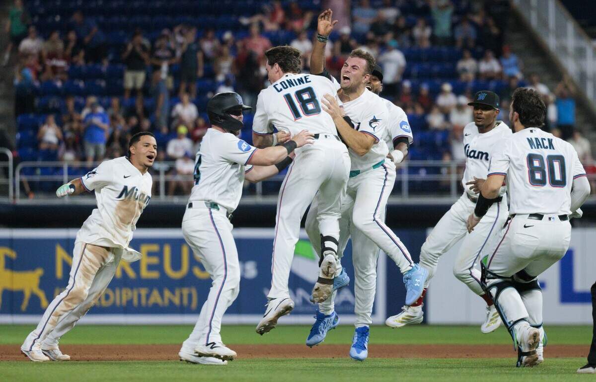 Miami Marlins right fielder Griffin Conine (18) celebrates after hitting a walk off single to win the game against the Philadelphia Phillies during the ninth inning on Monday, July 27, 2026, at loanDepot Park in Miami, Fla.